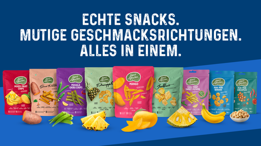 Natural vegan fruit and vegetable chips in colorful Super Munchies packs displayed with real ingredients.